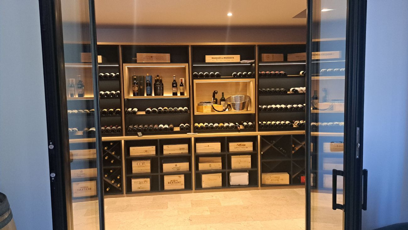 Design Wine Cellar in Langhirano: Winest has created a custom, climate-controlled, and functional wine room in the heart of the land of Parma Ham.