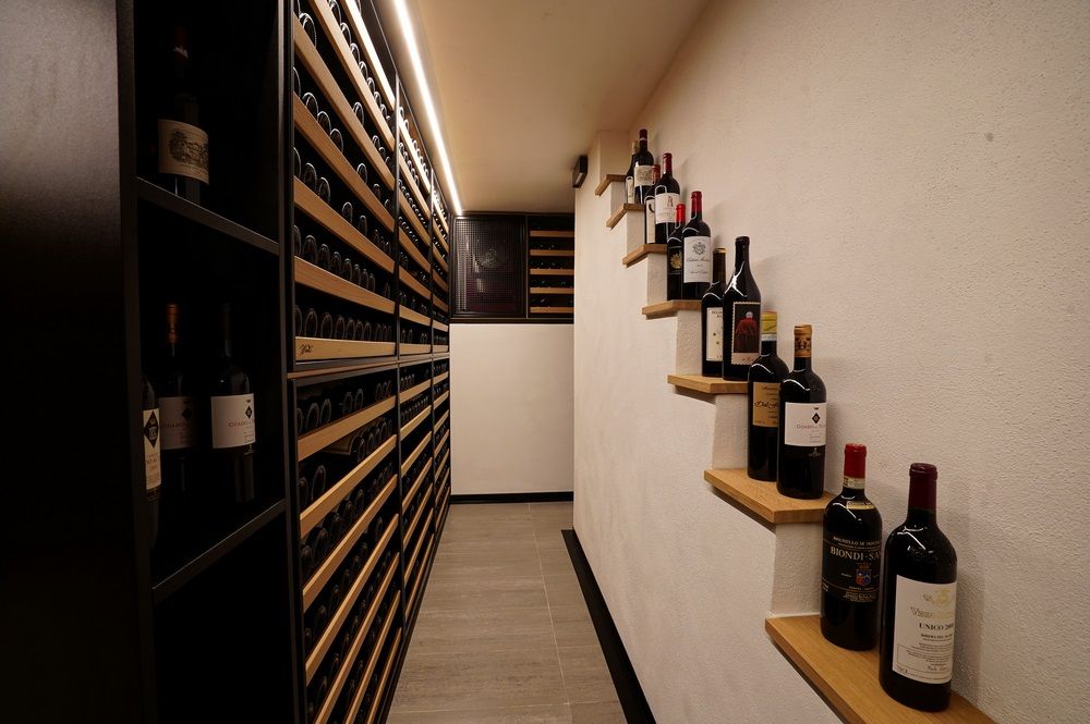 Image of a beautifully designed luxury modern wine cellar in Tuscan house